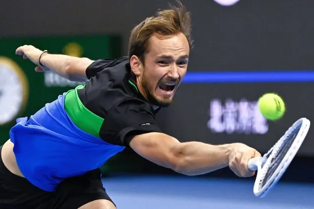 Russia's Daniil Medvedev hits a return to Italy's Jannik Sinner during their men's singles final match at the China Open tennis tournament in Beijing on October 4, 2023. (Photo by Pedro Pardo/AFP Photo)