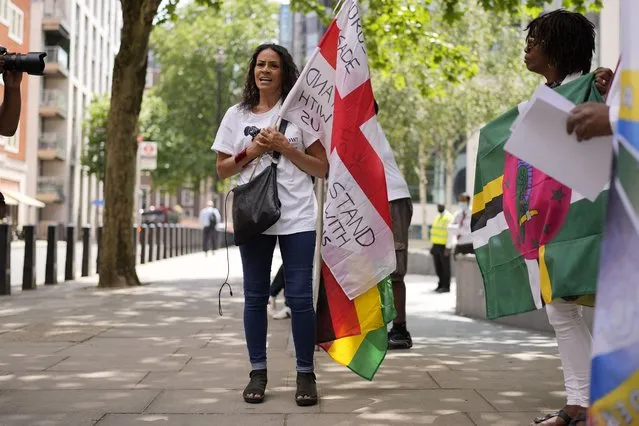 A Windrush campaigner speaks during a protest gathering outside the Home Office in London, Wednesday, June 23, 2021. People whose lives were torn apart when the government improperly questioned their right to be in the U.K. are demanding that a program designed to compensate them be taken out of the hands of the agency that violated their rights. Many legal residents who came to Britain from the Caribbean lost their homes, jobs and right to medical care when they were targeted by Home Office efforts to crack down on illegal immigration. (Photo by Matt Dunham/AP Photo)