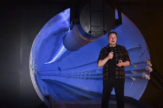 Elon Musk, co-founder and chief executive officer of Tesla Inc., speaks during an unveiling event for the Boring Co. Hawthorne test tunnel in Hawthorne, Calif., on Tuesday, December 18, 2018. Musk has unveiled his underground transportation tunnel, allowing invited guests to take some of the first rides ever on the tech entrepreneur's solution to “soul-destroying traffic”. (Photo by Robyn Beck/Pool Photo via AP Photo)
