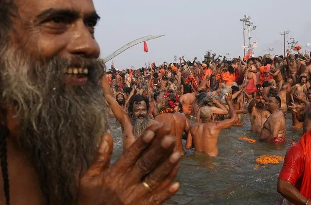 Naga Sadhus or Hindu holy men take a dip during the second “Shahi Snan” (grand bath) at the “Kumbh Mela” or the Pitcher Festival, in Prayagraj, previously known as Allahabad, India, February 4, 2019. (Photo by Anushree Fadnavis/Reuters)