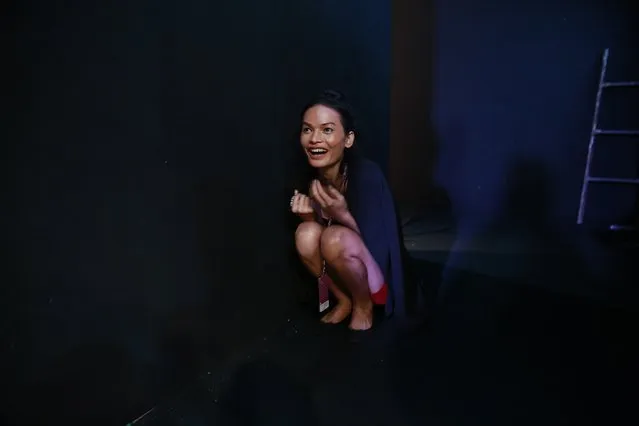 In this February 1, 2017 photo, Anjali Lama, a transgender model from Nepal, sits backstage as she waits to take part in a rehearsal during Lakme Fashion week in Mumbai, India. To model for Lakme Fashion Week, one of the highlights of India's fashion calendar, is Lama's big moment. It's a dream that was years in the making and often seemed far beyond the reach of Lama now being touted as the first transgender woman to model for the high fashion event sponsored by a top Indian cosmetics brand. (Photo by Rafiq Maqbool/AP Photo)