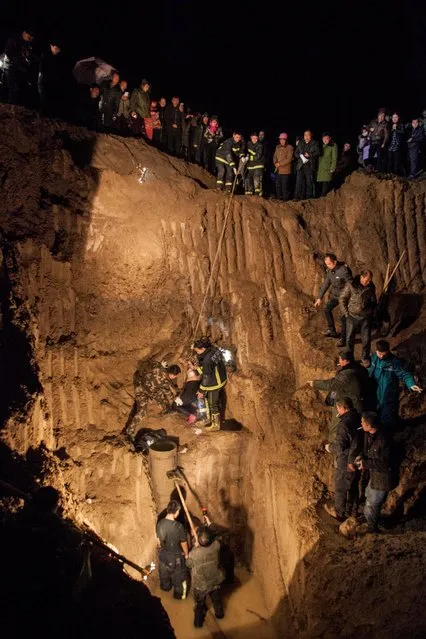 Rescuers save a girl who falls into a motor-driven well and is trapped for hours in Linying county, Henan province, China, February 8, 2017. (Photo by Reuters/China Daily)