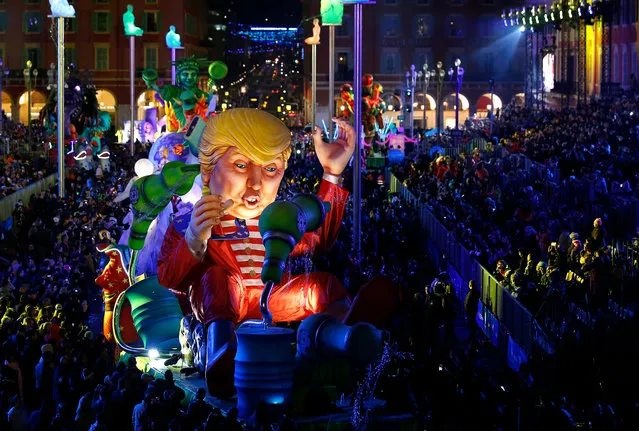 A float of US President Donald J. Trump entitled “Wind of change” goes through the crowd during the Nice carnival parade, in Nice, France, 11 February 2017. The theme of the annual Carnival of Nice is “King of Energy”. The event runs from 11 to 25 February. (Photo by Sebastien Nogier/EPA)