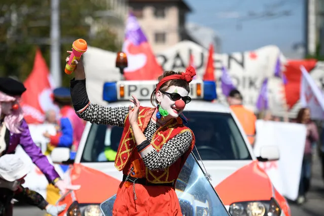 A protester, dressed as a clown, marches on a road to mark Labor Day in Zurich, Switzerland, 01 May 2019. (Photo by Ennio Leanza/EPA/EFE)