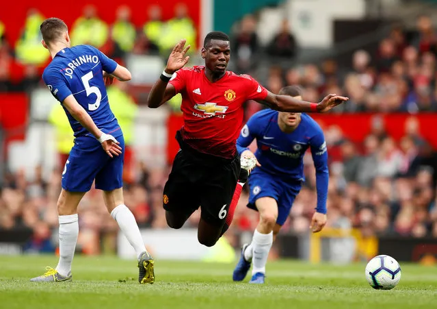 Paul Pogba of Manchester United tries to get past Jorginho and Mateo Kovacic of Chelsea during the Premier League match between Manchester United and Chelsea FC at Old Trafford on April 28, 2019 in Manchester, United Kingdom. (Photo by Jason Cairnduff/Action Images via Reuters)