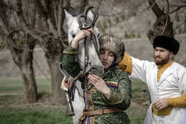 Sevilay Cakir, an English teacher in Ankara's Pursaklar district, who started traditional horse archery, is viewed with her husband Davut, in Ankara, Turkiye on March 03, 2024. Sevilay Cakir, who started traditional horse archery about 10 years ago with the support of her husband, broke the Turkish record for women by scoring 40.75 points on the table3 course in the races in Aksehir last year. Cakir, mother of 2 children, wants to be one of the women representing her country abroad by entering the top 15 in Turkiye with her horse Akduman. (Photo by Ozge Elif Kizil/Anadolu via Getty Images)