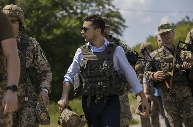 Ukrainian President Volodymyr Zelenskiy visits the war-hit Luhansk region, eastern Ukraine, Monday, May 27, 2019. (Photo by Ukrainian Presidential Press Office via AP Photo)