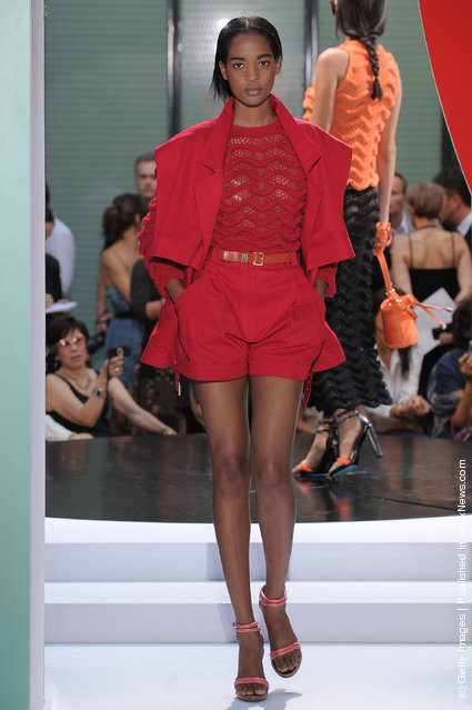 A model walks the runway at the Kenzo Spring Summer 2012 fashion show during Paris Fashion Week
