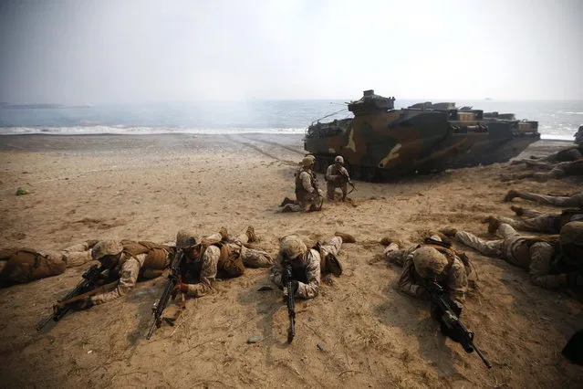 U.S. marines participate in a U.S.-South Korea joint landing operation drill in Pohang March 31, 2014. (Photo by Kim Hong-Ji/Reuters)