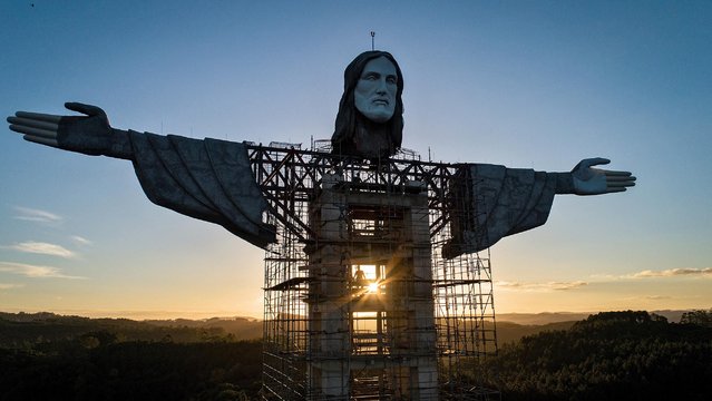 Aerial picture taken with a drone shows the Cristo Protector, still under construction in Encantado, Rio Grande do Sul, Brazil, 12 April 2021. On a hill in southern Brazil, the skeleton of a huge statue has been growing for a little over a year. It is the so-called Cristo Protector, a 43-meter high monument that aims to combine religious devotion and the promotion of tourism. This statue is promoted as one of the 'largest in the world' in honour of Jesus of Nazareth, after a similar one inaugurated in 2010 in the Polish city of Swiebodzin, which measures 52 meters, and as 'the tallest in Brazil' with five meters more than the Cristo Redentor of Rio de Janeiro. (Photo by Daniel Marenco/EPA/EFE)