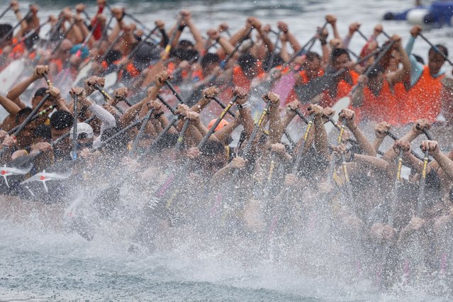 Dragon boats compete during the annual Tuen Ng, or Dragon Boat Festival, at Aberdeen fishing port in Hong Kong on June 10, 2024. (Photo by Tyrone Siu/Reuters)