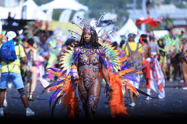 A member of Yuma- Awakened Treasure parades during the last day of the carnival at Queens's park Savannah in Port of Spain, Trinidad and Tobago on February 21, 2023. Trinidad and Tobago celebrated its carnival in style, which is one of the most important in the Caribbean, after a two-year break forced by the Covid-19 pandemic. (Photo by Andrea De Silva/EPA)