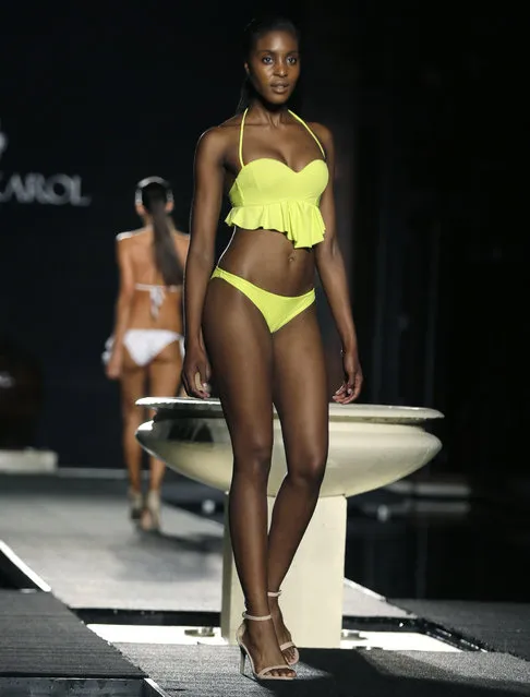 A model walks down the runway during the Sinesia Karol swimwear show as part of Funkshion Fashion Week Swim, Friday, July 17, 2015, in Miami Beach, Fla. (Photo by Lynne Sladky/AP Photo)