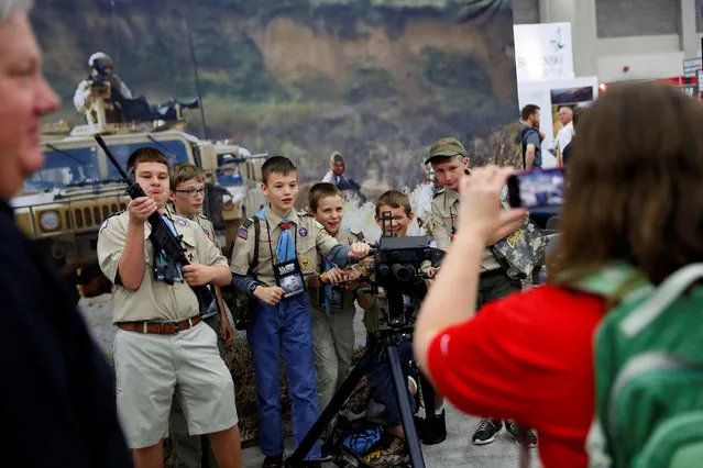Attendees visit the trade booths during the National Rifle Association's annual meeting in Louisville, Kentucky, May 21, 2016. (Photo by Aaron P. Bernstein/Reuters)