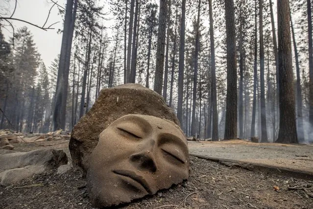 Whole neighborhoods were destroyed by the Caldor fire, which raced through Grizzly Flats, Calif., on Tuesday, August 17, 2021. (Photo by Ethan Swope/AP Photo)