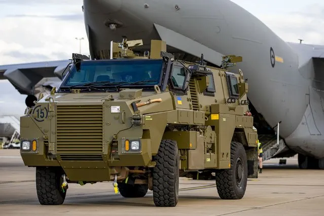 In this photo provided by the Australian Defense Force, a Bushmaster protected mobility vehicle bound for Ukraine waits to be loaded onto a C-17A Globemaster III aircraft at RAAF Base Amberley, Australia, Thursday, April 7, 2022. (Photo by LACW Emma Schwenke/Royal Australian Air Force via AP Photo)