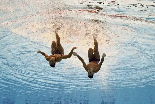 Gemma Mengual and Paul Ribes of Spain are seen underwater as they perform in the synchronised swimming mixed duet free routine preliminary at the Aquatics World Championships in Kazan, Russia July 28, 2015. (Photo by Michael Dalder/Reuters)