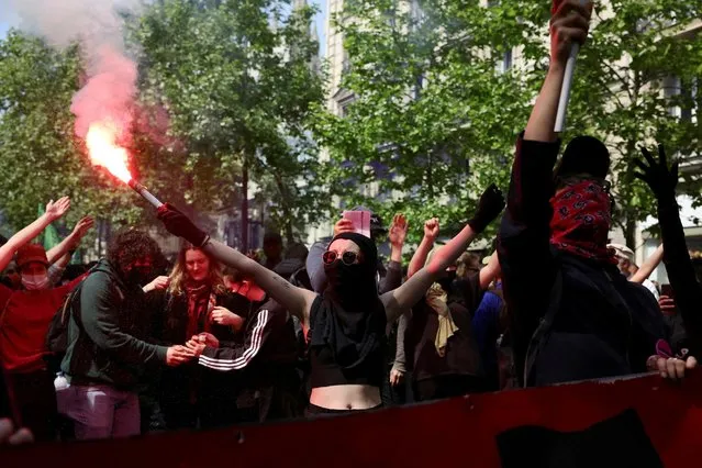 Masked protesters take part in the traditional May Day labour union march in Paris, France, May 1, 2022. (Photo by Sarah Meyssonnier/Reuters)