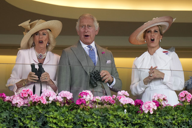 Britain's King Charles III, Camilla, the Queen Consort and Sophie, Duchess of Edinburgh, right, react as they watch a race at day two of the Royal Ascot horse racing meeting, at Ascot Racecourse in Ascot, England, Wednesday, June 21, 2023. (Photo by Alastair Grant/AP Photo)