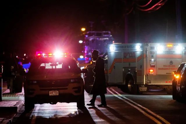 A Jewish man walks near the area where 5 people were stabbed at a Hasidic rabbi's home in Monsey, New York, U.S., December 29, 2019. (Photo by Eduardo Munoz/Reuters)