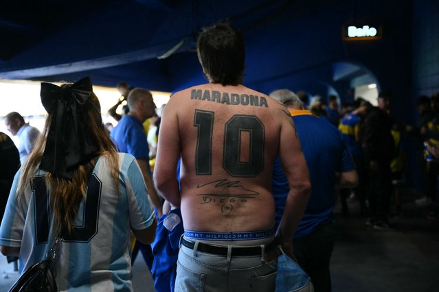 A Boca Juniors fan with a tattoo honouring late Argentine soccer legend Diego Maradona is pictured during the 2024 Argentine Professional Football League tournament match between Boca Juniors and River Plate at the Alberto Jose Armando “La Bombonera” stadium, in Buenos Aires on September 21, 2024. (Photo by Luis Robayo/AFP Photo)