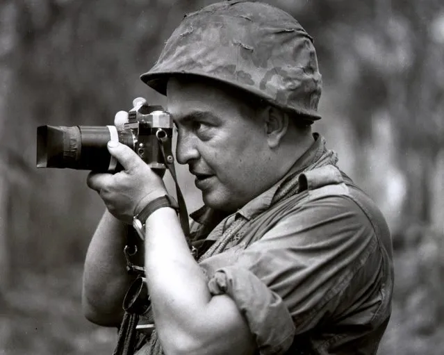 In this 1967 photo, Associated Press photographer Horst Faas works in Vietnam. Faas, a prize-winning combat photographer who carved out new standards for covering war with a camera and became one of the world's legendary photojournalists in nearly half a century with The Associated Press, died May 10, 2012. He was 79