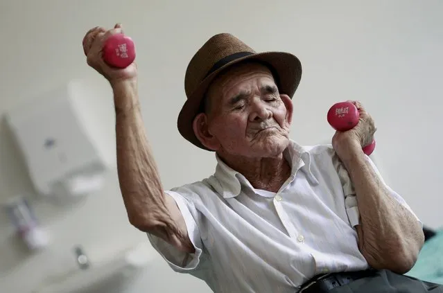 Jose Uriel Delgado, 115, better known locally as “Chepito” exercises during an individualised therapy at nursing home Sisters of Charity in San Jose, Costa Rica August 11, 2015. This elderly Costa Rican man reportedly born at the turn of the 20th century could be the world's oldest, but his lack of documentation and testimony from family and friends could see his alleged 115-year-old out of the record books. Luis Bolanos, Director General at Costa Rica's Civil Registry said official records back up the oldest-man-in-the-world claim. (Photo by Juan Carlos Ulate/Reuters)