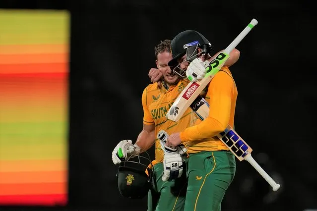 South Africa's David Miller, left, and Rassie van der Dussen celebrate their win in the first Twenty20 cricket match between India and South Africa in New Delhi, India, Thursday, June 9, 2022. (Photo by Altaf Qadri/AP Photo)