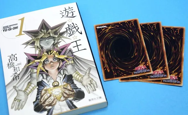 This photo shows “Yu-Gi-Oh!” manga comic and trading cards in Tokyo Thursday, July 7, 2022. Kazuki Takahashi, the creator of the “Yu-Gi-Oh!” manga comic and trading card game, has died, apparently while snorkeling in southwestern Japan, the coast guard said Friday, July 8, 2022. (Photo by Shohei Miyano/Kyodo News via AP Photo)