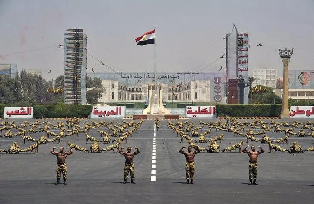 Soldiers perform during a ceremony, attended by Egypt's new Islamist President Mohamed Mursi at the Egyptian military academy in Cairo on July 17, 2012. (Photo by Sheriff Abd El Minoem/AP/Reuters)