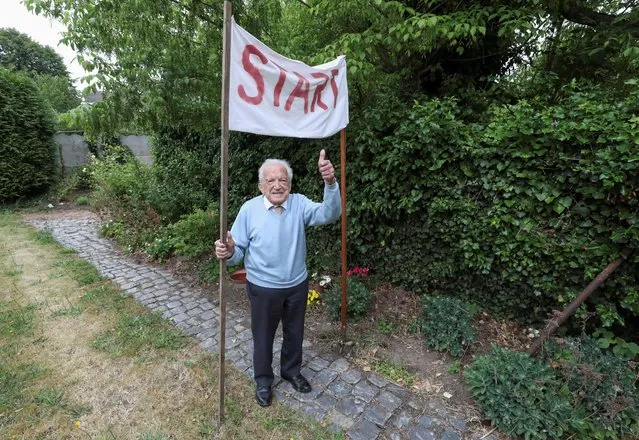 103-year-old Belgian oldest former general practitioner Alfons Leempoels poses next to a start line intending to walk the equivalent of a marathon in his garden to raise money for scientists researching the coronavirus disease (COVID-19) in Rotselaar, Belgium on June 9, 2020. (Photo by Yves Herman/Reuters)