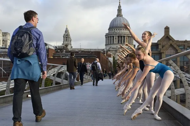 Candidates in the Royal Academy of Dance's Genee International Ballet Competition pose for photographs on Millennium Bridge on September 18, 2015 in London, England. (Photo by Ben Pruchnie/Getty Images)