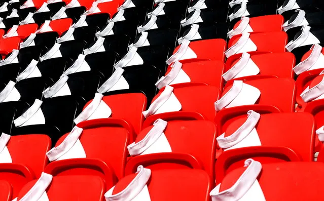 Caps are placed on spectators' seats before the FIFA World Cup 2022 group E soccer match between Japan and Costa Rica at Ahmad bin Ali Stadium in Doha, Qatar, 27 November 2022. (Photo by Ali Haider/EPA/EFE)