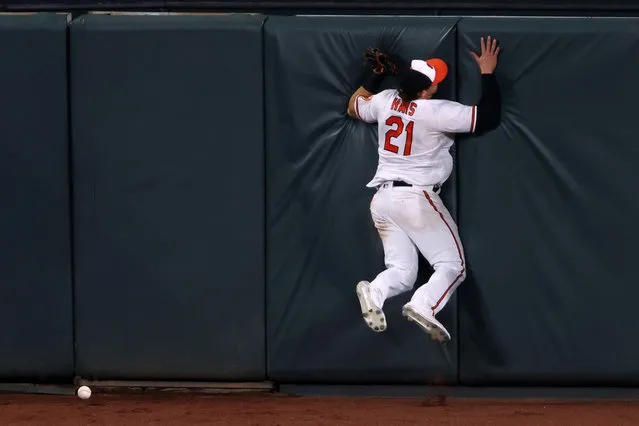 Centerfielder Austin Hays #21 of the Baltimore Orioles miss plays an RBI triple hit by Brian Anderson #15 of the Miami Marlins (not pictured) in the seventh inning at Oriole Park at Camden Yards on August 06, 2020 in Baltimore, Maryland. (Photo by Rob Carr/Getty Images)