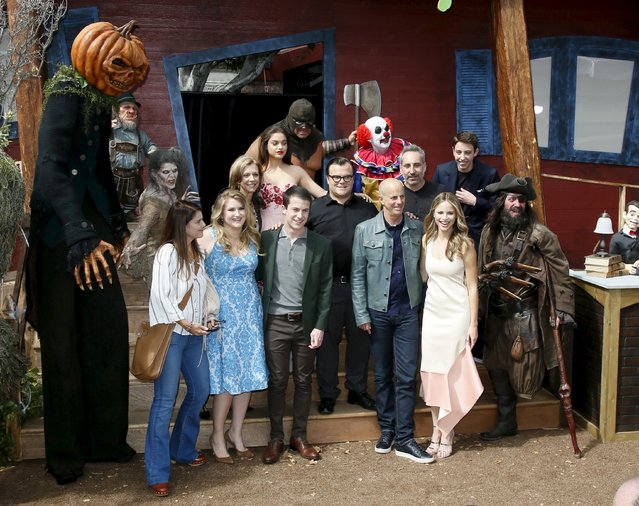 The cast, producers and director Rob Letterman pose with people dressed as monsters at the premiere of the film “Goosebumps”, in Los Angeles, California October 4, 2015. (Photo by Danny Moloshok/Reuters)