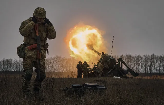 Ukrainian soldiers fire a Pion artillery system at Russian positions near Bakhmut, Donetsk region, Ukraine, Friday, December 16, 2022. (Photo by LIBKOS/AP Photo)