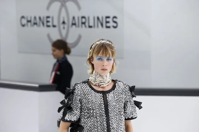 A model presents a creation by German designer Karl Lagerfeld as part of his Spring/Summer 2016 women's ready-to-wear collection for fashion house Chanel at the Grand Palais which is transformed into a Chanel airport during Fashion Week in Paris, France, October 6, 2015. (Photo by Benoit Tessier/Reuters)