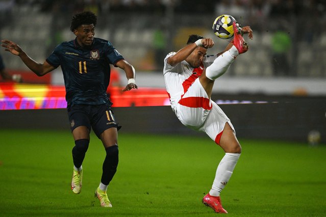 Ecuador's forward #11 Kevin Rodriguez and Peru's defender #05 Carlos Zambrano fight for the ball during the 2026 FIFA World Cup South American qualifiers football match between Peru and Ecuador at the National stadium in Lima, on June 10, 2025. (Photo by Ernesto Benavides/AFP Photo)