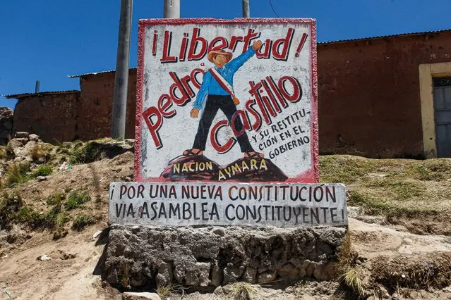 A painted wall that reads “Pedro Castillo freedom” is seen near the Ilave International Bridge which is blocked by members of Aymara communities in Ilave, Puno, Peru on January 16, 2023. “We are going to be in the capital to make our voice of protest heard”, promises an Andean leader who is preparing together with hundreds of peasants to go from Puno to Lima to demand the resignation of the President Dina Boluarte as part of the protests that have been going on for five weeks and have left 42 dead. (Photo by Juan Carlos Cisneros/AFP Photo)
