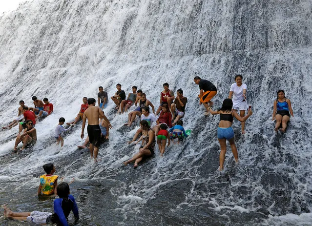 People take a dip in the flowing waters of Wawa Dam in Rodriguez, Rizal province, Philippines March 4, 2018. (Photo by Dondi Tawatao/Reuters)