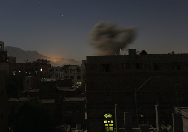 Smoke rises from a neighborhood following airstrikes allegedly carried out by the Saudi-led coalition, in Sana'a, Yemen, 27 October 2015. According to reports, the Saudi-led coalition intensified airstrikes on several positions in the Houthi-held capital Sana'a and other cities throughout Yemen. (Photo by Yahya Arhab/EPA)