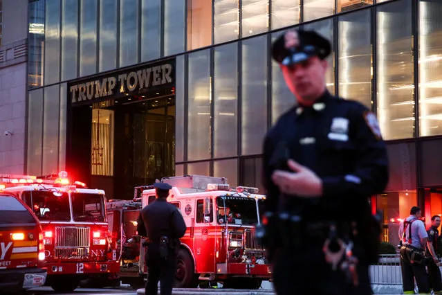 First responders work on a fire in a residential unit at Trump tower in the Manhattan borough of New York City, New York, April 7, 2018. The Fire Department says a blaze broke out on the 50 th floor of the building shortly before 6 p. m. Saturday. (Photo by Amr Alfiky/Reuters)