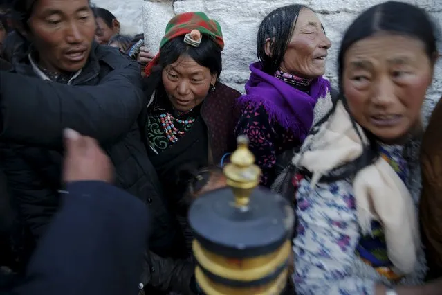 Pilgrims struggle at narrow entrance as they wait to enter the Jokhang Temple in central Lhasa, Tibet Autonomous Region, China early November 20, 2015. (Photo by Damir Sagolj/Reuters)