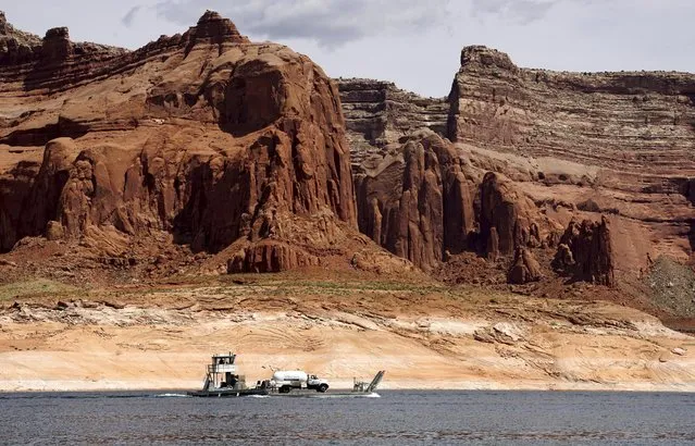 A barge carries a propane truck on Lake Powell near Page, Arizona, May 27, 2015. (Photo by Rick Wilking/Reuters)