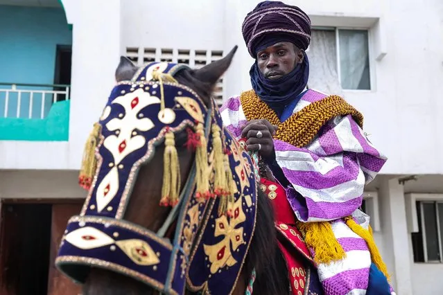 A horseman is seen before a parade during the Durbar Festival in Ilorin on April 21, 2023. The durbar Festival is an annual cultural, religious and equestrian festival dating from the 14th Century. it coincides witht the Eid al-Fitr, the end of the fasting month of Ramadan. (Photo by Samuel Alabi/AFP Photo)