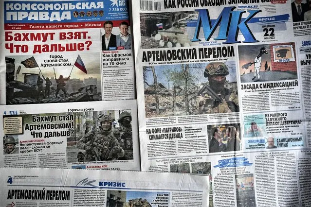 A combo of Russian national newspapers on Monday, May 22, 2023, all leading with news on the taking of control of the city of Bakhmut, after the longest and most grinding battle, in Moscow, Russia, Monday, May 22, 2023. Russia claims it has won control of Ukraine's eastern city of Bakhmut after a nine-month conflict in which tens of thousands of fighters have died. (Photo by Alexander Zemlianichenko/AP Photo)