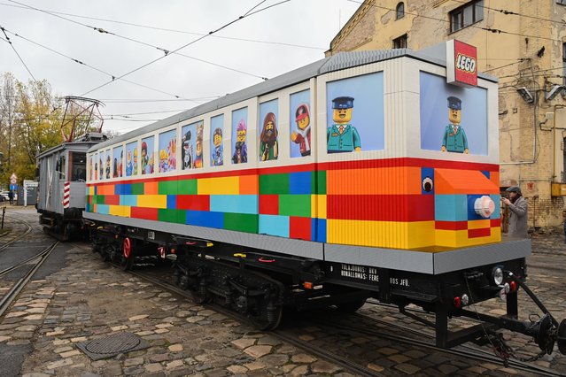 A general view of the world's first fixed-track LEGO tram, the “LEGO Vili”, after its presentation in Budapest, Hungary, 20 November 2024. The tram, made from 1.8 million LEGO bricks is 11.5 meters long, 2 meters tall, and 2 meters wide, with a total weight of 6 tons. Balazs Doczi designed the project, which was completed in about 6,800 hours by approximately 90 builders. (Photo by Zoltan Mathe/EPA/EFE)