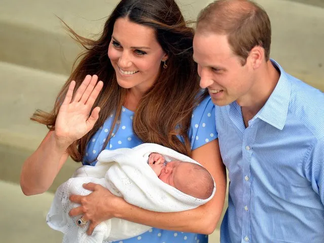 Safe in the hands of the Duchess of Cambridge, the Royal couple and their son who was born Monday, leave the Lindo Wing of St Mary's Hospital in west London Tuesday July 23, 2013. (Photo by John Stillwell/AP Photo)