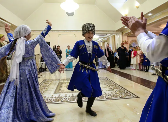 Guests dance during a traditional Chechen wedding ceremony in Grozny, Chechnya, Russia on November 24, 2016. (Photo by Valery Sharifulin/TASS)