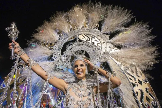 Aranzazu Estevez, wearing a creation called “La princesa de las mil rosas” (the princess of a thousand roses), reacts after being elected Carnival Queen in Las Palmas, capital of Spanish Canary Island of Gran Canaria, February 14, 2015. (Photo by Borja Suarez/Reuters)